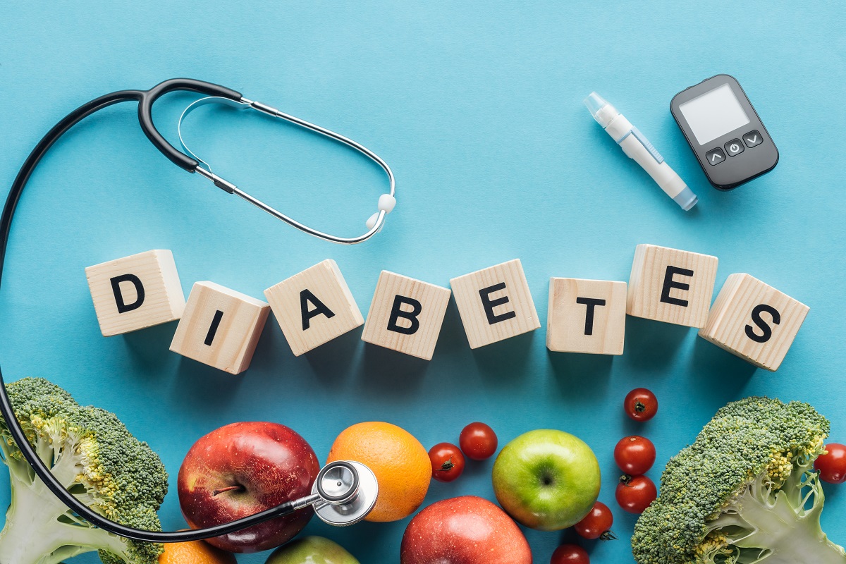 Diabetes Lettering Made Of Wooden Cubes With Medical Equipment And Fruits On Blue Background